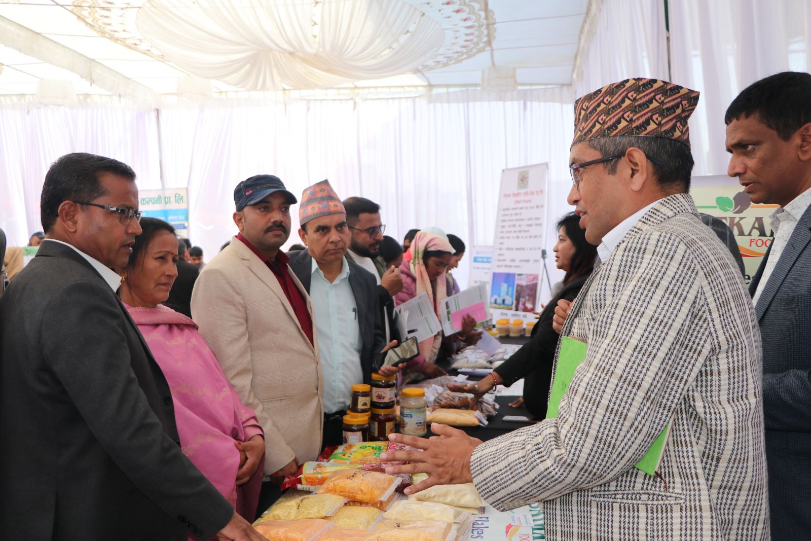 Hon.-Bir-Bahadur-Thapa,-Minister-for-Land-Management,-Agriculture-and-Co-operatives,-Sudurpaschim-Province-observes-stall-1734171510.JPG